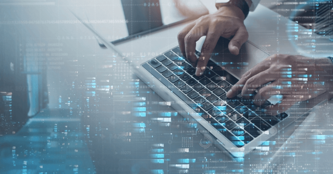 Photo of hands on a laptop typing with a futuristic overlay representing an expanded portfolio
