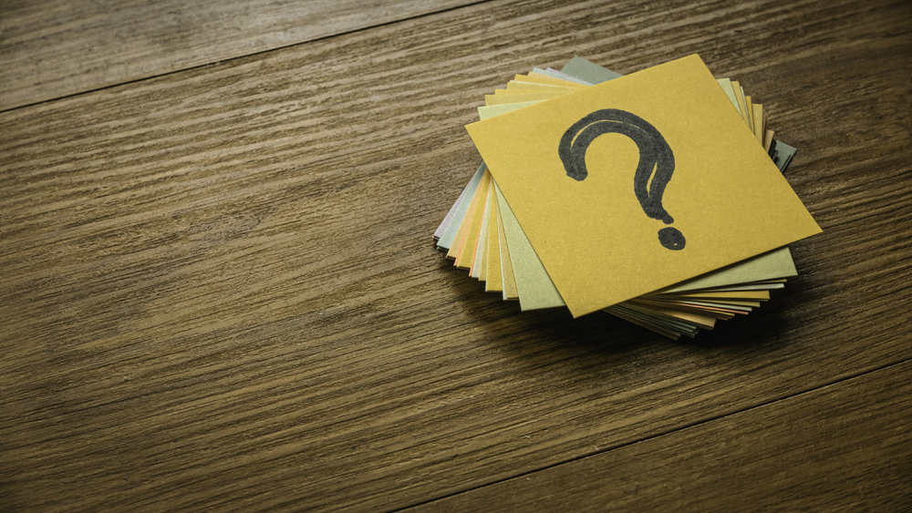 colorful-question-marks-on-sticky-notes-on-wood-2026-09-23-04-09-26-utc-1