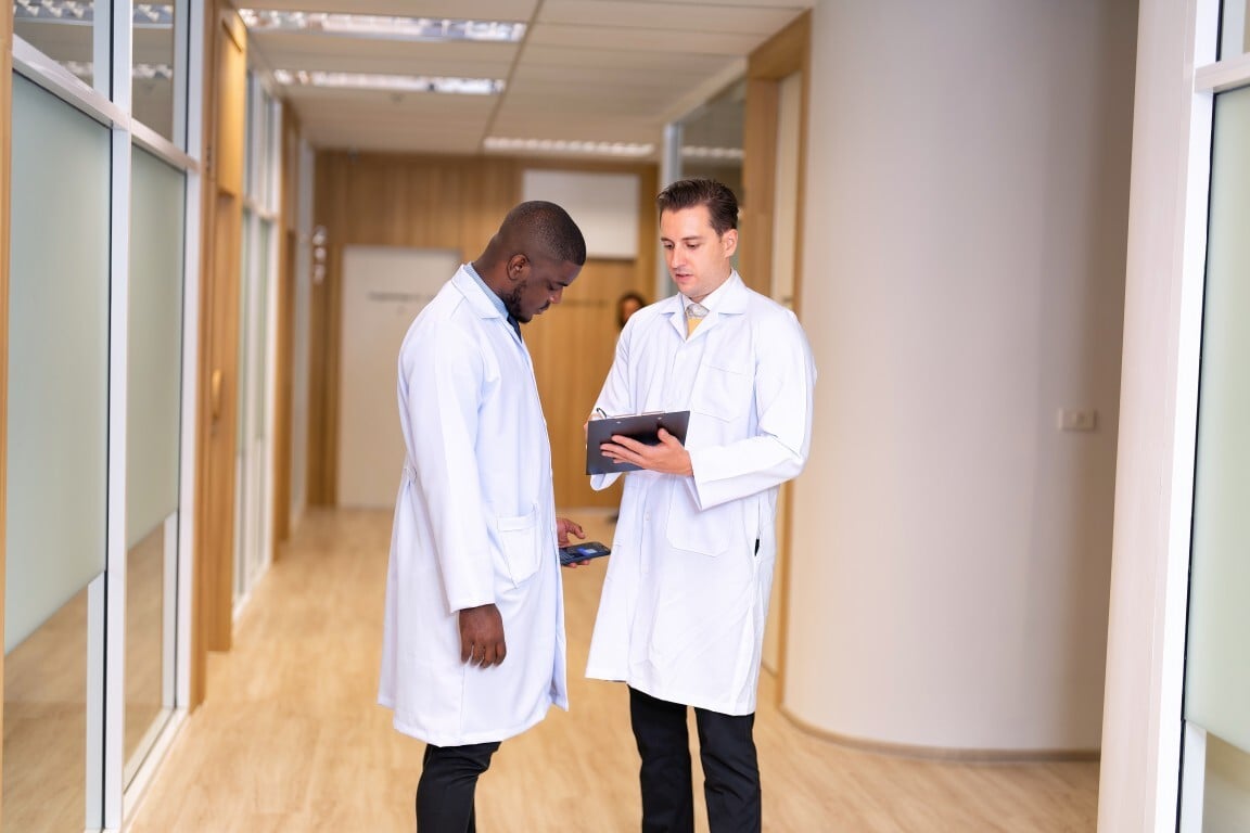 doctors-discussing-medical-notes-in-hospital-hallw-2026-09-22-17-01-21-utc (Medium)
